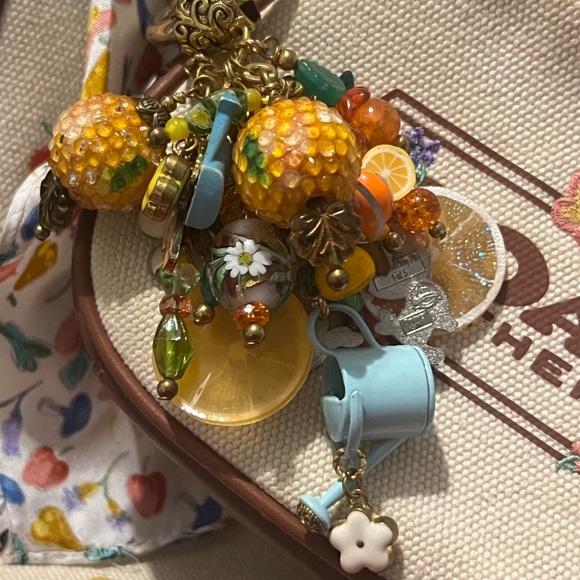 Coach Field Tote Floral w/ Matching Coach Floral Purse, Coach Scarf, & Charm - Picture 12 of 16